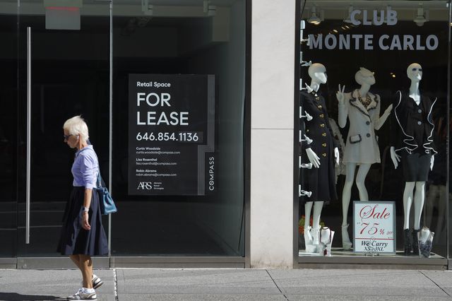 A pedestrian walks past a store for lease in NYC on September 4th, 2020.